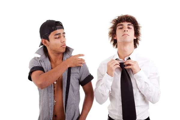 Young latin men, gesturing with a finger - removing something from the shoulder (a white boy), isolated on white, studio shot — Stock Photo, Image