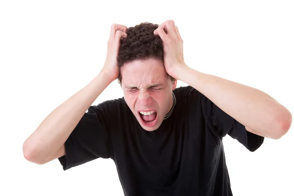 Strongly afflicted young man, screaming and pulling hair, on white background. Studio shot — Stock Photo, Image