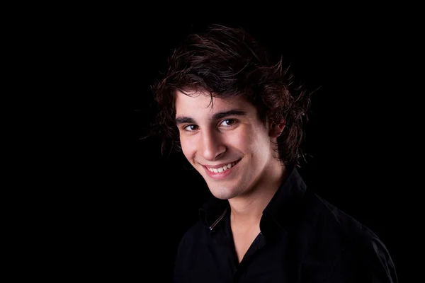Cute boy, smiling on black, studio shot — Stock Photo, Image