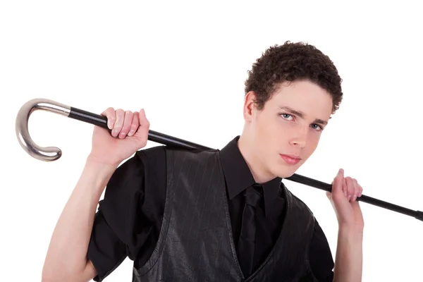Joven hombre confiado sosteniendo un bastón, aislado en blanco, plano de estudio — Foto de Stock