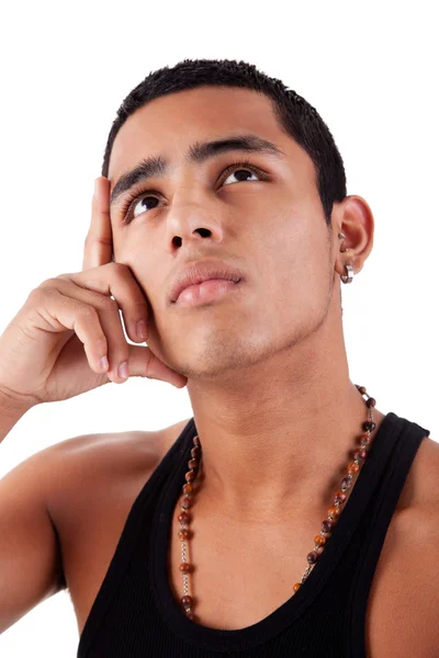 Young and handsome latin man, with hand holding the face - thinking, isolated on white, studio shot — Stock Photo, Image