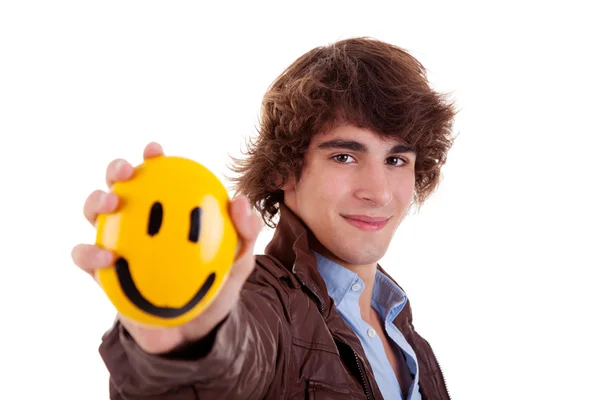 Man with a yellow smile face on hand, isolated on white, studio shot — Stock Photo, Image