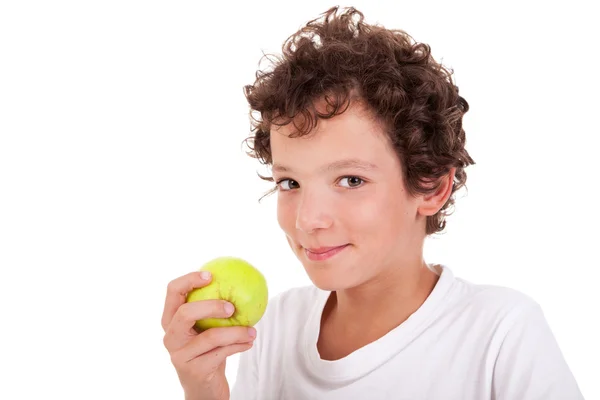 Niño comiendo una manzana verde, aislado sobre fondo blanco —  Fotos de Stock