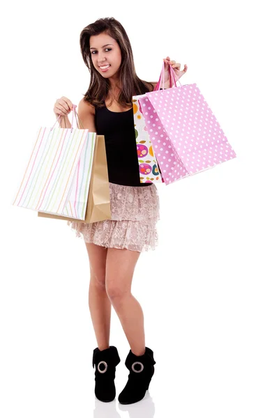 Chica feliz con bolsas de compras, aislado sobre un fondo blanco. Captura de estudio . —  Fotos de Stock
