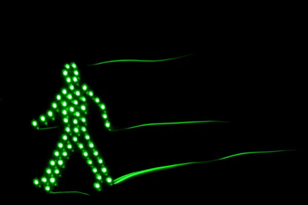 stock image Pedestrian traffic light green, isolated on a black background