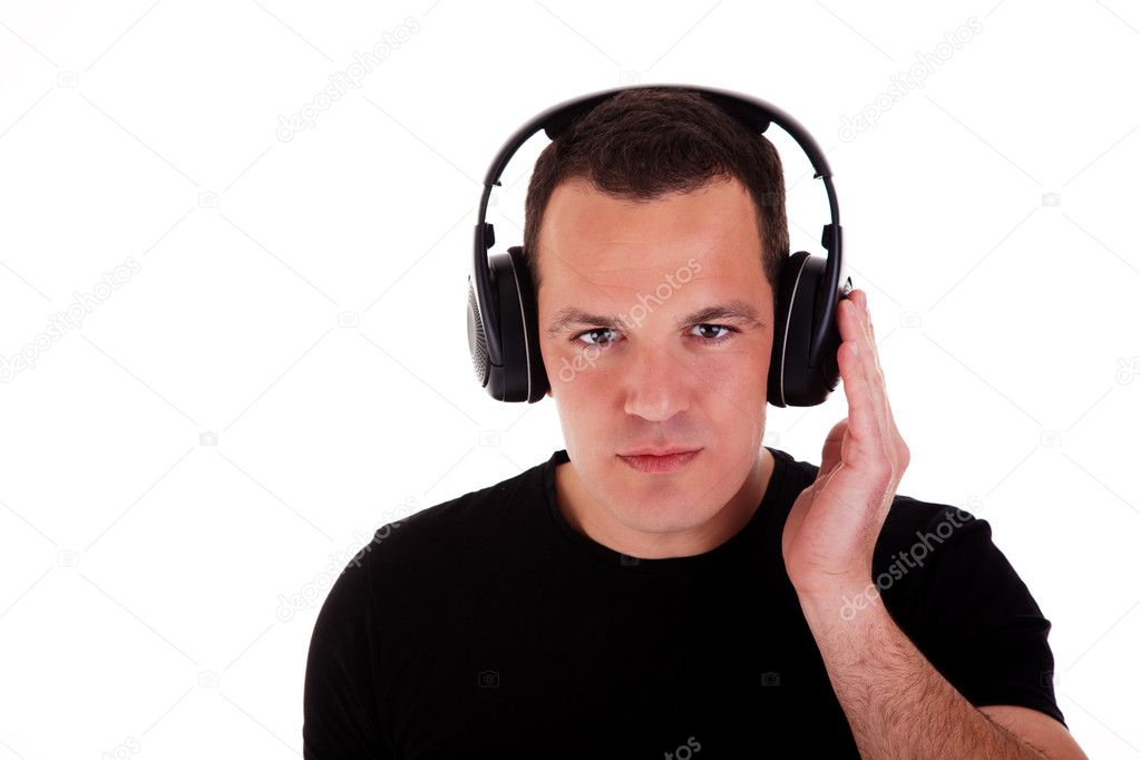 Man listening music in headphones, isolated on white background, studio shot