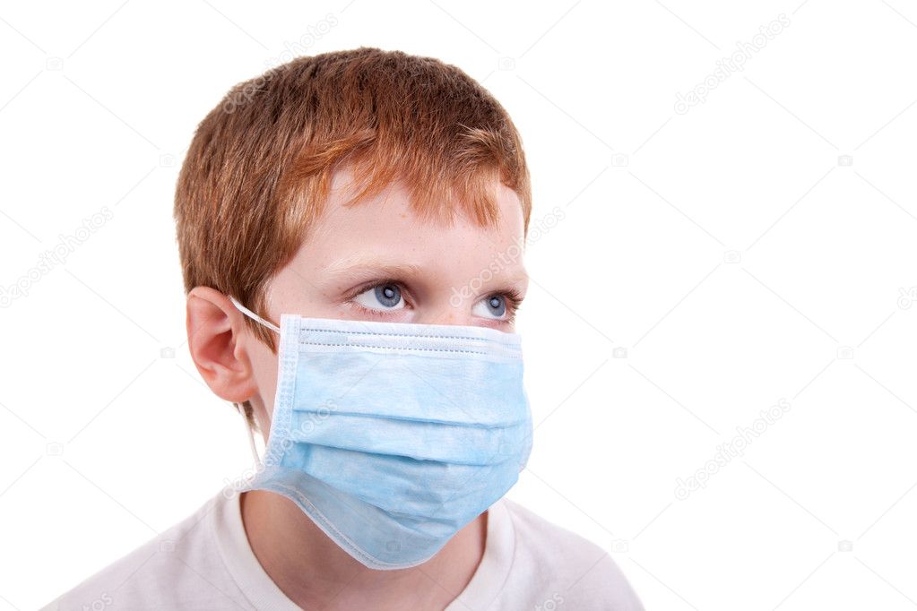 Young boy with a medical mask, isolated on white, studio session