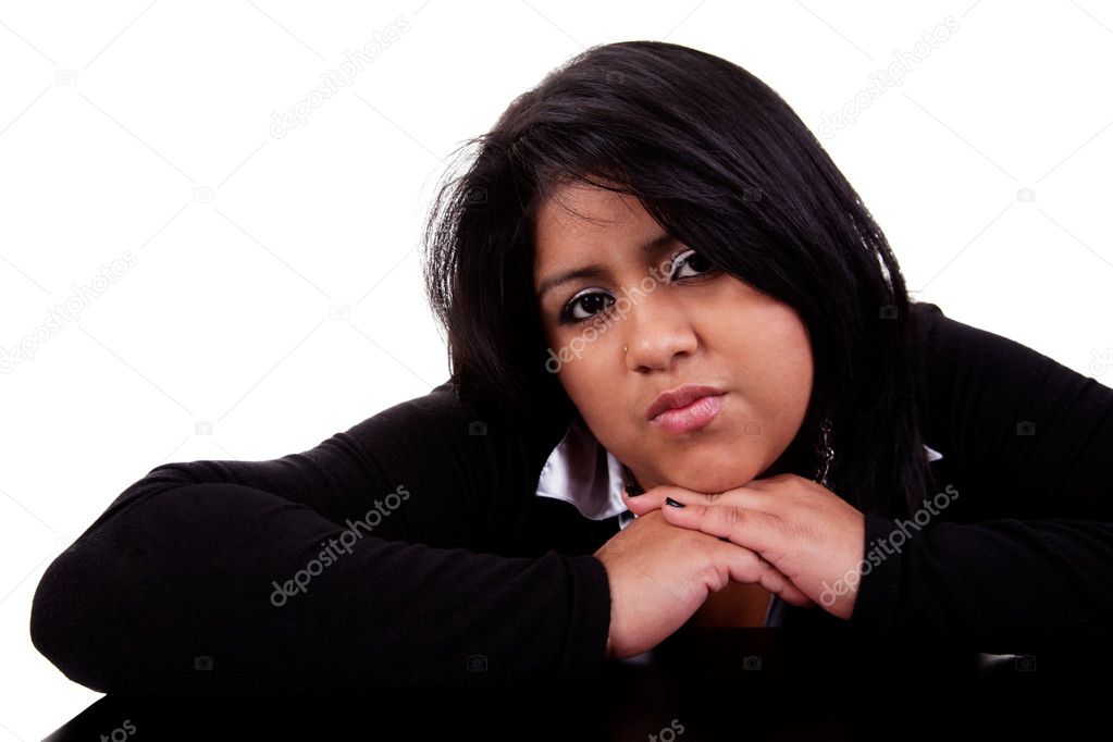 Thinking large latin woman, isolated on white studio shot