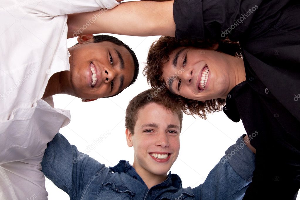 Three young man of different colors,looking to camera and smiling, view from below