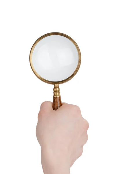 Magnifier in hand Royalty Free Stock Photos