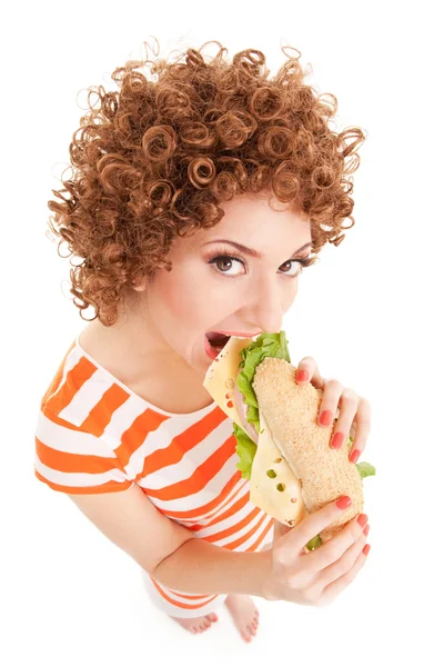 Donna divertente con panino sullo sfondo bianco — Foto Stock