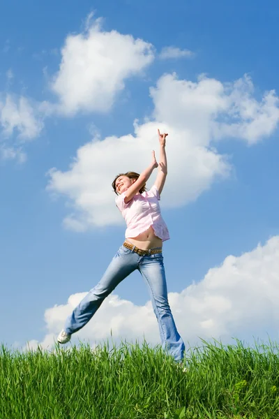 Pretty young woman is jumping — Stock Photo, Image