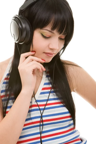 Jonge vrouw in oortelefoons — Stockfoto