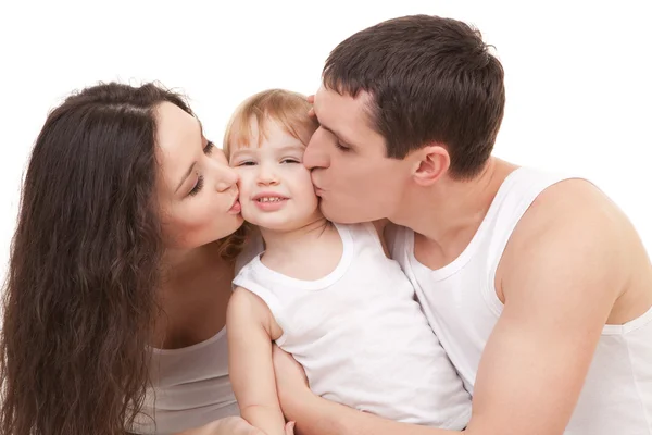 Happy family, mother, father and daughter on the white bed — Stock Photo, Image