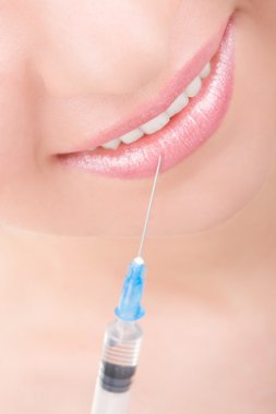 Smiling girl with syringe clipart