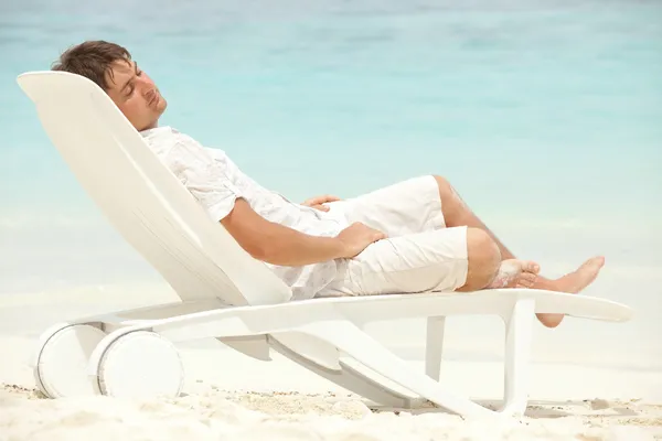 Stock image Happy man rest on the beach