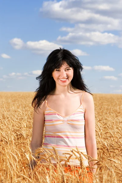 Pretty woman in golden wheat — Stock Photo, Image