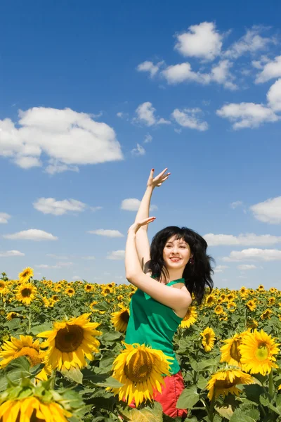 Fun woman dance in the field of sunflowers — Stock Photo, Image