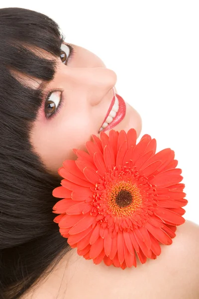 Νεαρή γυναίκα με το κόκκινο λουλούδι — 图库照片