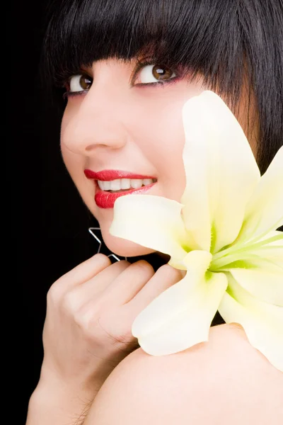 Mujer joven con flor — Foto de Stock