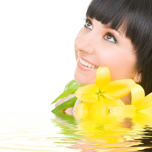 Young woman with flowers — Stock Photo, Image