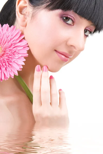 Молода жінка з квітками-гербами — стокове фото