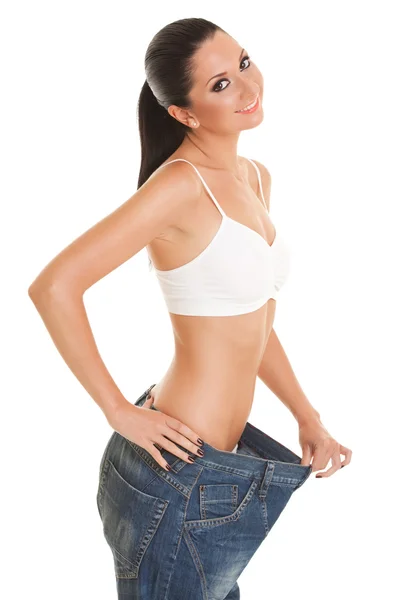Lustige Frau zeigt ihren Gewichtsverlust — Stockfoto