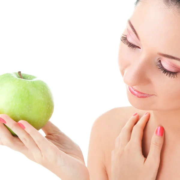 Süßes Mädchen isst grünen Apfel auf weißem Hintergrund — Stockfoto