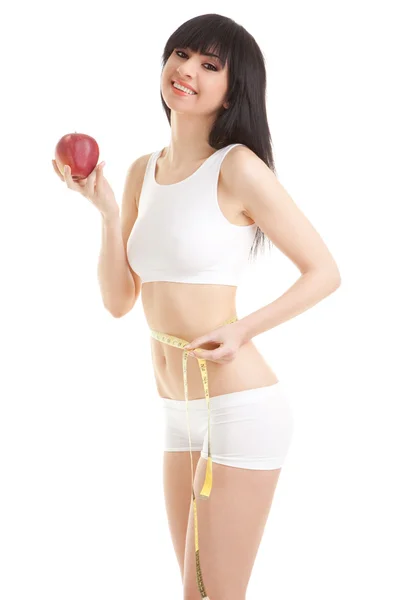Mujer con manzana roja y cinta métrica — Foto de Stock