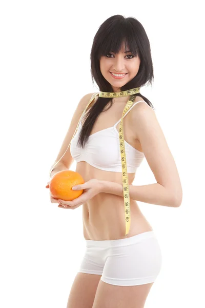 Sevimli kadın portakal ve ölçü bandı ile — Stok fotoğraf