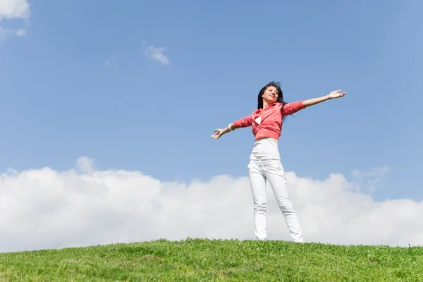 Happy young woman dreams to fly on winds — Stock Photo, Image