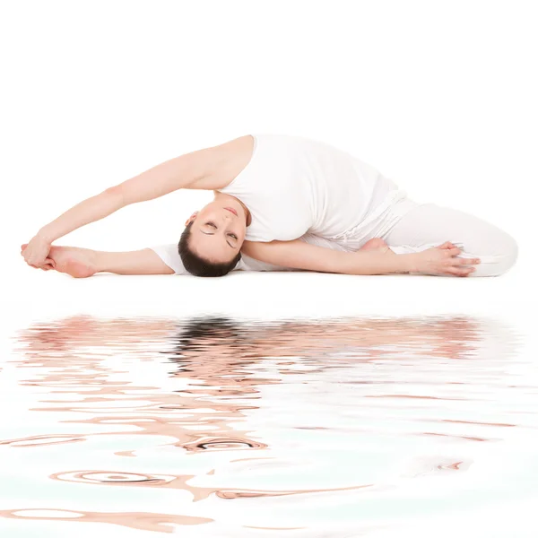 stock image Young woman doing yoga exercise