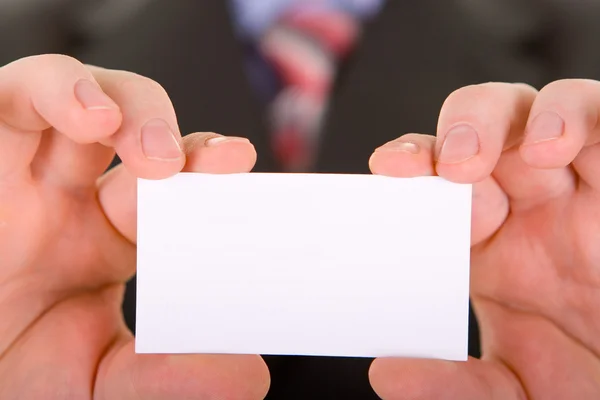 Business card in a hand — Stock Photo, Image
