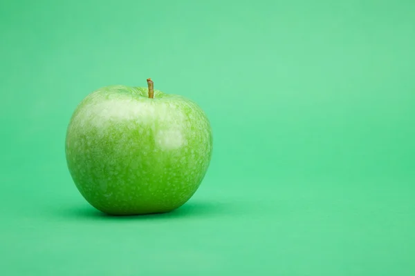 stock image Apple in green background