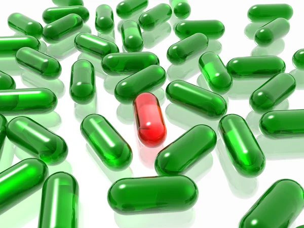 Červené a zelené pilulky — Stock fotografie