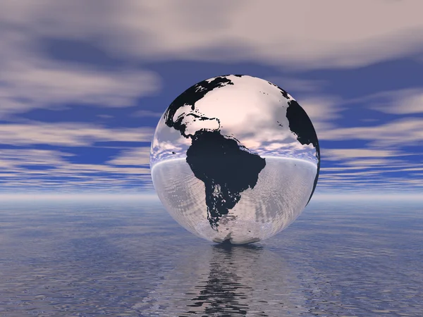 Глобус в океане — стоковое фото