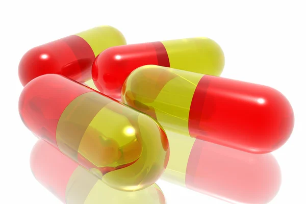 Punainen ja keltainen pillereitä — kuvapankkivalokuva