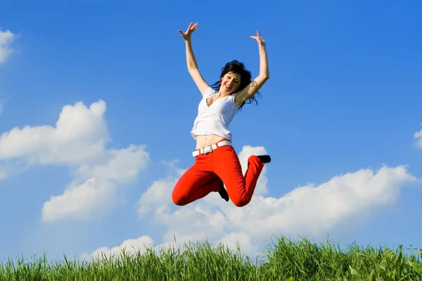 Pretty young woman is jumping Stock Picture