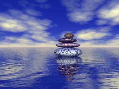 Stack of balanced stones on the sea clipart