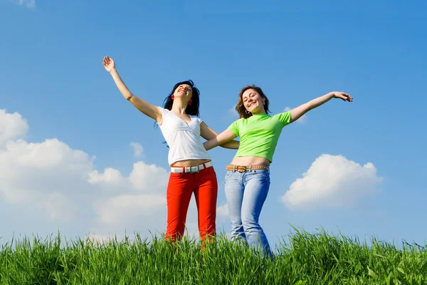 stock image Two happy young women dreams to fly on winds