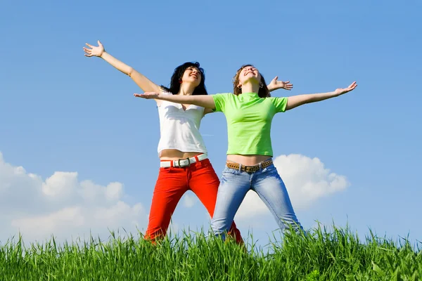 stock image Two happy young women dreams to fly on winds