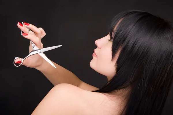Lovely brunette with scissors of the hairdresser — Stock Photo, Image