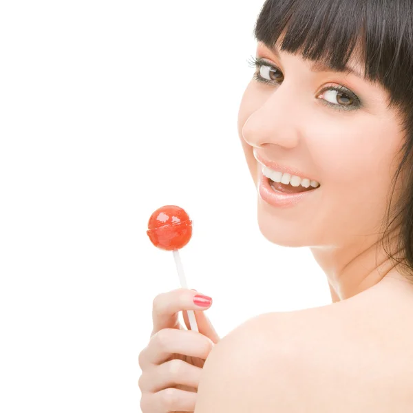 Сладкая женщина с конфетами на белом фоне — стоковое фото