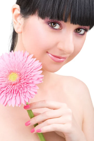 Молодая женщина с цветком гербера — стоковое фото