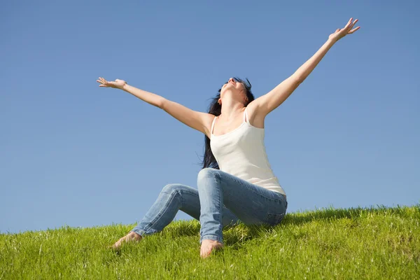 Happy young woman dreams to fly on winds — Stock Photo, Image
