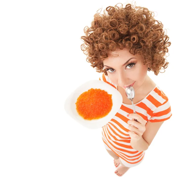 Mujer comiendo caviar sobre el fondo blanco de la diversión — Stockfoto