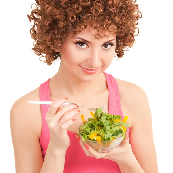 Fun woman eating the salad on the white background — Stock Photo, Image