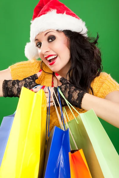 Spaß Weihnachtsmann Frau mit Farbverpackungen — Stockfoto