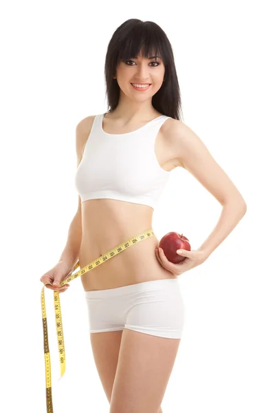 Woman with red apple and measure tape — Stock Photo, Image