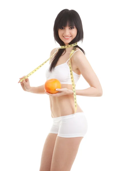 Mulher bonito com laranja e fita métrica — Fotografia de Stock